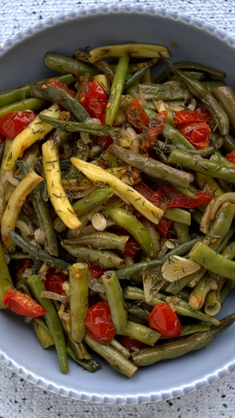 Green beans sauted with tomatoes and onion. Vertical video. Stock Footage 296497482