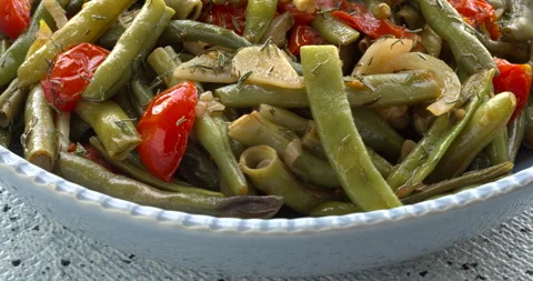 Green beans sauted with tomatoes and onion. Video stock 296497483