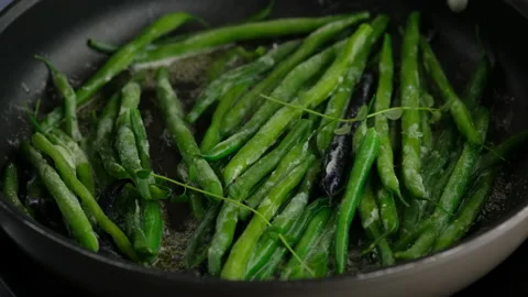 Green beans with spices ready for cooking in frying pan. Bio green beans Stock Footage 153403144