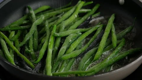 Green beans with spices ready for cooking in frying pan. Bio green beans Stock Footage 153403988