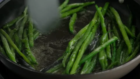 Green beans with spices ready for cooking in frying pan. Bio green beans Stock Footage 153404353