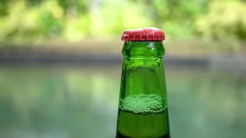 Green beer bottle under water splashes. Stock Footage 104060462