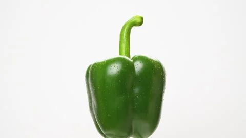 Green Bell Pepper Rotating On White Background With Water Drops Stock Footage 325562304