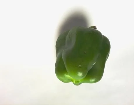 Green bell pepper on white background. Stock Photos