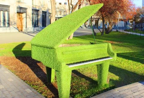A green bench in a park Stock Photos
