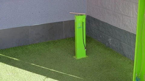 Green Bicycle Pump Station on Artificial Grass Surface Stock Footage 300895437