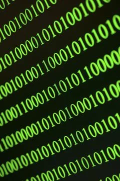 Green binary numbers displayed blurred and fast, conveys digital data Stock Photos