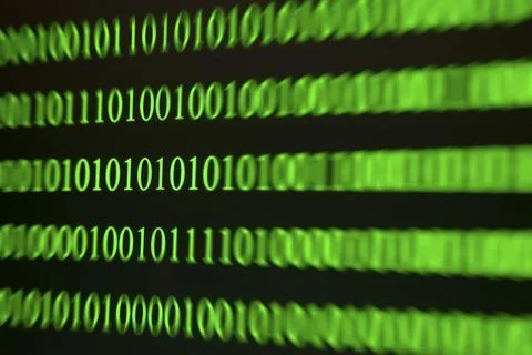 Green binary numbers displayed blurred, digital-technological atmosphere Stock Photos