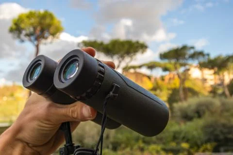 Green Binoculars in Hand Stock Photos