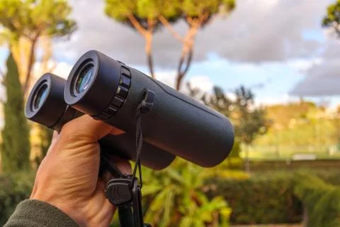 Green Binoculars in Hand Stock Photos
