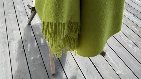 Green Blanket Elegantly Draped on Wooden Stand Stock-Footage 343864787