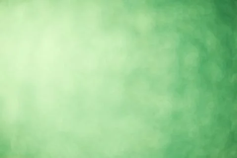 Green blurred background glitter background. Defocused sparkles Stock Illustration