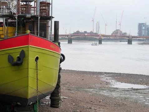 Green boat by river Stock Photos