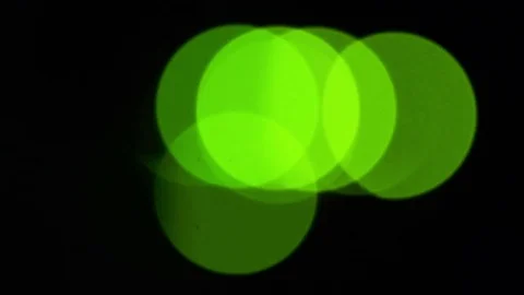 Green bokeh LED lights blinking on back side of working switch in server room Stock Footage 84579294