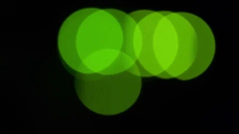 Green bokeh LED lights blinking on back side of working switch in server room Stock Footage 84579319