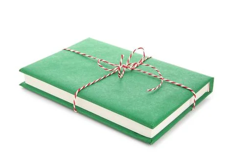 Green book tied with string on white background. Christmas celebration Stock Photos