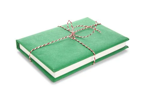 Green book tied with string on white background. Christmas celebration Stock Photos