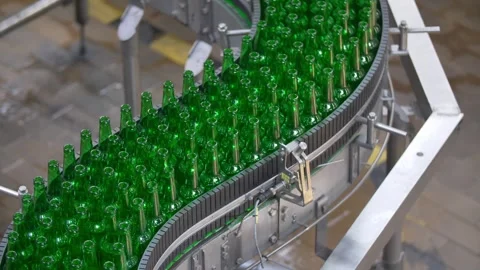 Green bottles without labels go along the conveyor 스톡 동영상 240926603