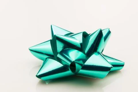 Green bow for a present on a white background. Stock Photos