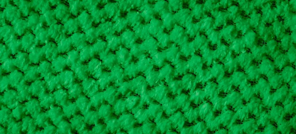 Green braided material with an interesting pattern Stockfoto's