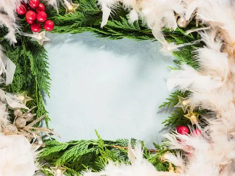 Green branches frame with star shape Christmas lights red decor Stock Photos