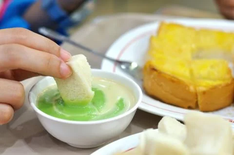 Green bread custard with steam bread and butter toast Stock Photos