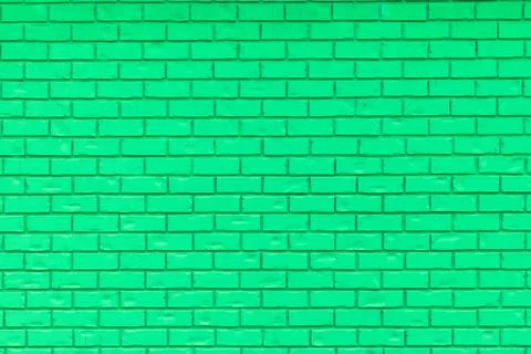 Green brick wall for use as a background. Stock Photos