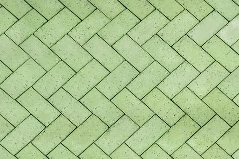 Green bricks tiled floor with zigzag pattern texture background Stock Photos