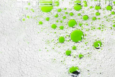 Green bubbles in water, abstract background. The concept of cleanliness Stock Photos