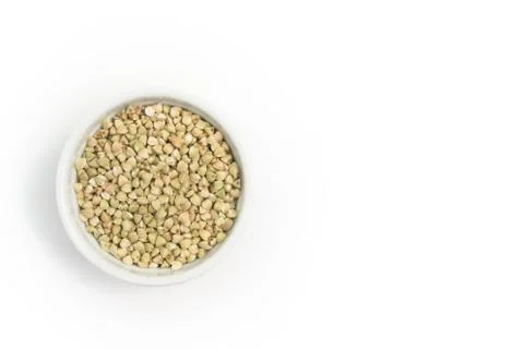 Green buckwheat on grey table in white bowl 写真素材