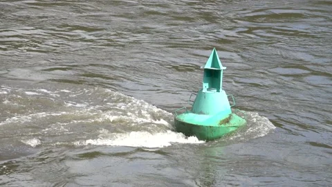 Green buoy fixed in the river stream Stock Footage 159066226