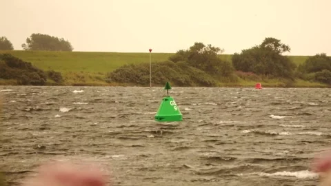 Green buoy in front of the harbor on the Grevelingen Stock Footage 252177045