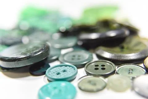Green buttons of different shape and size on the white background. Selective  Stock Photos
