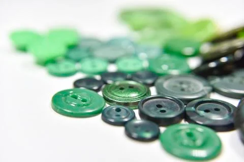 Green buttons of different shape and size on the white background. Selective  Stock Photos