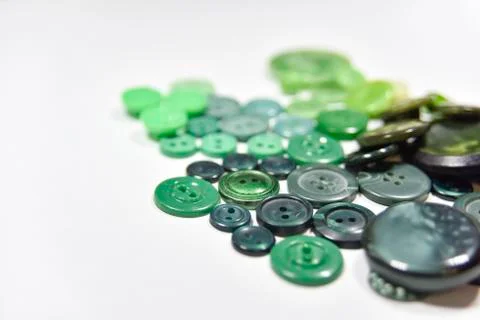 Green buttons of different shape and size on the white background. Selective  Stock Photos