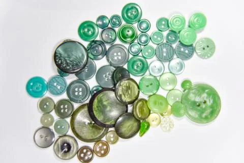 Green buttons of different shape and size on the white background. Selective  Stock Photos