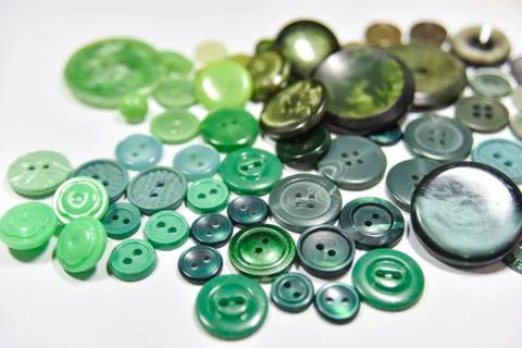 Green buttons of different shape and size on the white background. Selective  Stock Photos
