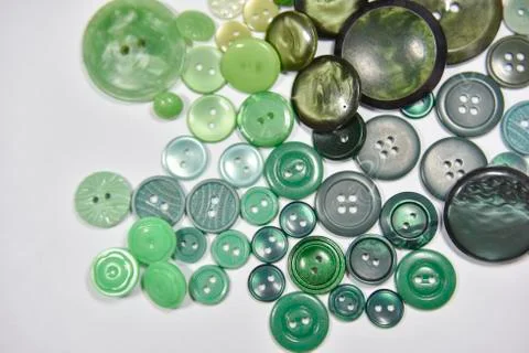 Green buttons of different shape and size on the white background. Selective  Stock Photos