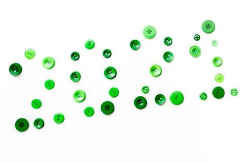 Green buttons in different sizes on white background lined with 2021 new year Stock Photos