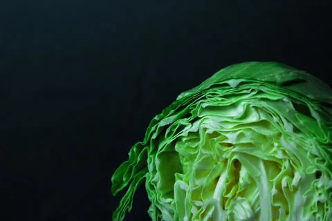 Green cabbage close-up isolated on black background Stock Photos