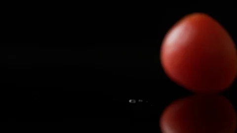 Green cabbage leaf falling against black background. Slow Motion. Stock Footage 79474467