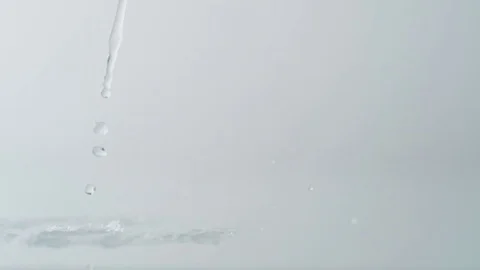 Green cabbage leaf falling on water surface. Slow Motion. Stock Footage 79854003