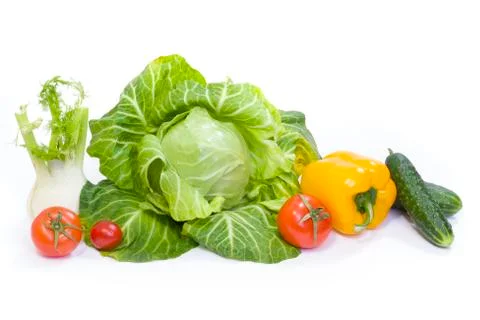 Green cabbage. Yellow pepper. Red tomatoes and cucumbers on a white backgroun Foto stock