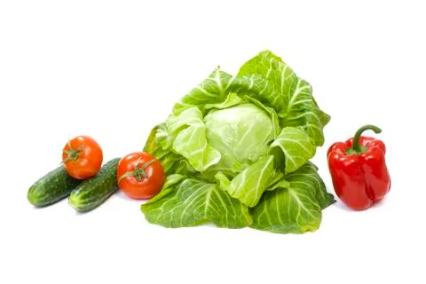 Green cabbage. Yellow pepper. Red tomatoes and cucumbers on a white background Foto stock