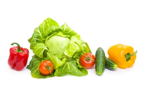 Green cabbage. Yellow pepper. Red tomatoes and cucumbers on a white background Stock Photos