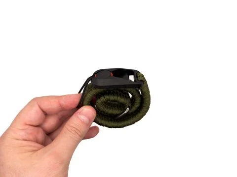 Green camera strap in the form of a rope on a white background. copy space, top Stock Photos