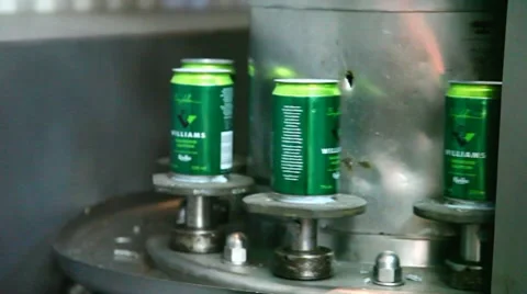 Green cans at an industry carousel Stock Footage 8689192