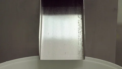 Green capsule pills falling from intermittent motion machine Stock Footage 102458692