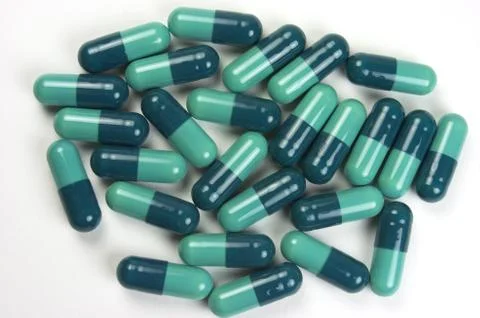 Green capsules Stock Photos