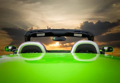 The green car with sunset Stock Photos